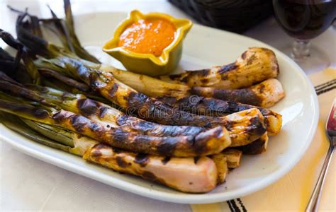  Calçots! A Delightful Catalan Onion Dish Roasted Over Charcoal and Served With Romesco Sauce!